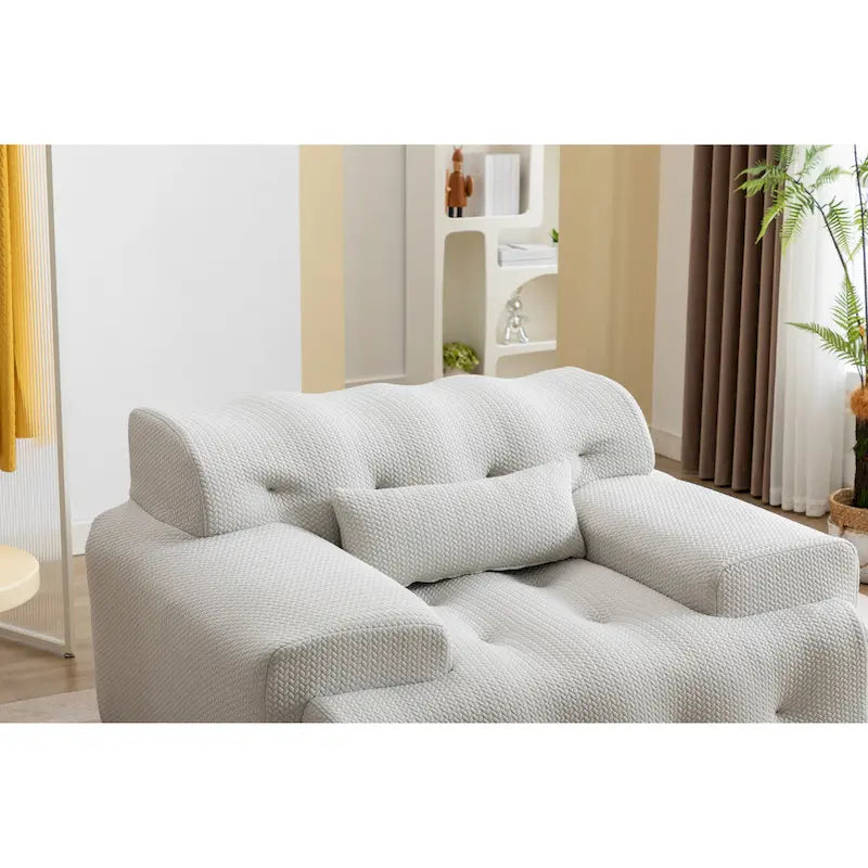 Fauteuil une place beige capitonné avec coussin en mousse haute densité