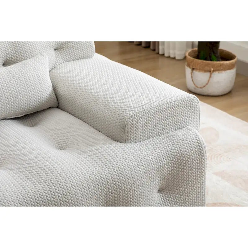 Fauteuil une place beige capitonné avec coussin en mousse haute densité
