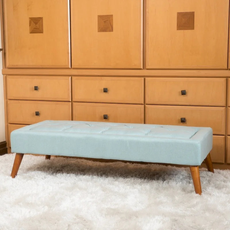 Banc ottoman en tissu capitonné avec pieds fuselés en bois multicolore