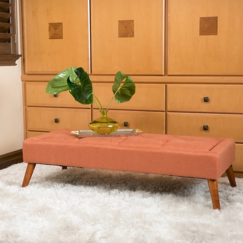 Banc ottoman en tissu capitonné avec pieds fuselés en bois multicolore
