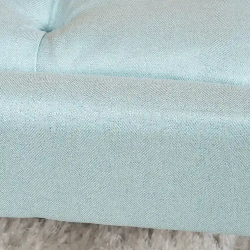 Banc ottoman en tissu capitonné avec pieds fuselés en bois multicolore