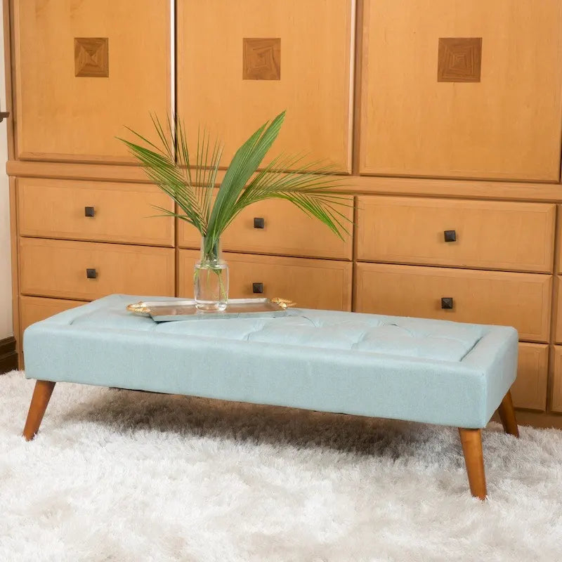 Banc ottoman en tissu capitonné avec pieds fuselés en bois multicolore