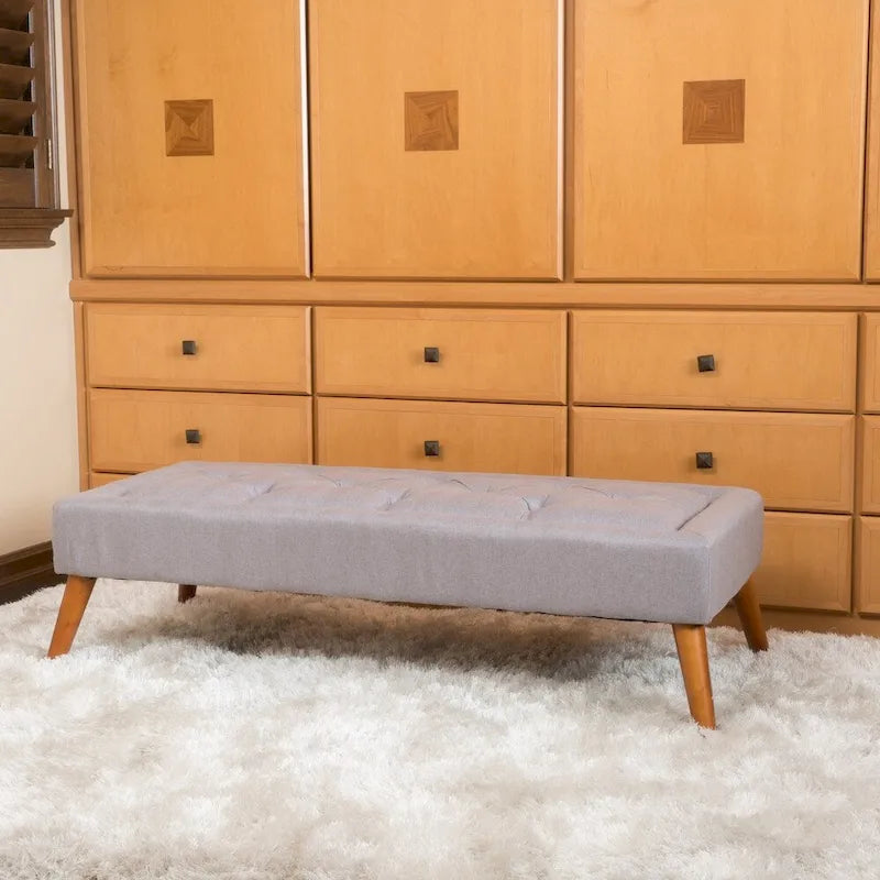 Banc ottoman en tissu capitonné avec pieds fuselés en bois multicolore