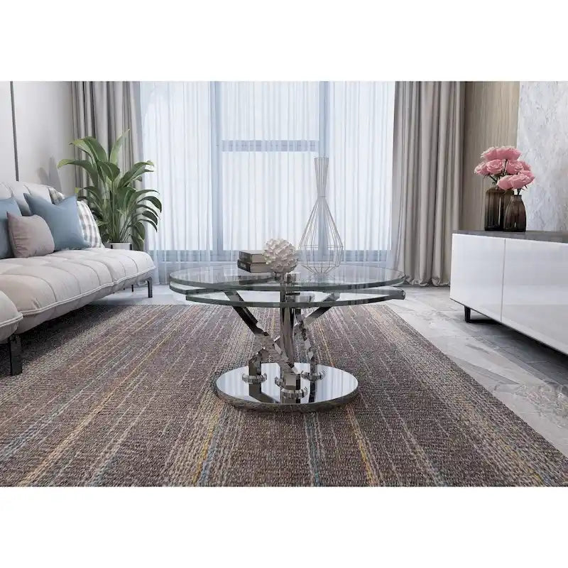 Table basse ronde pivotante en verre avec base en argent poli