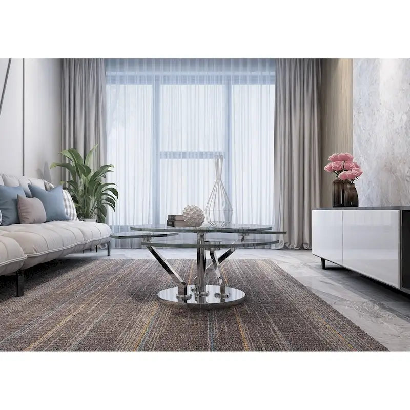 Table basse ronde pivotante en verre avec base en argent poli